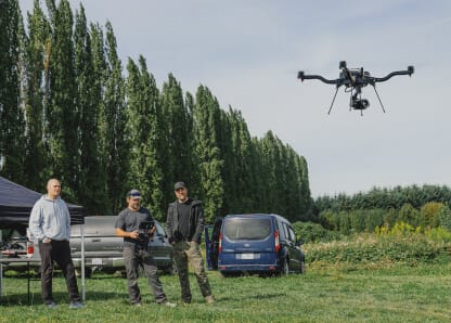 Training crew watching an Alta X Gen2 fly in the field